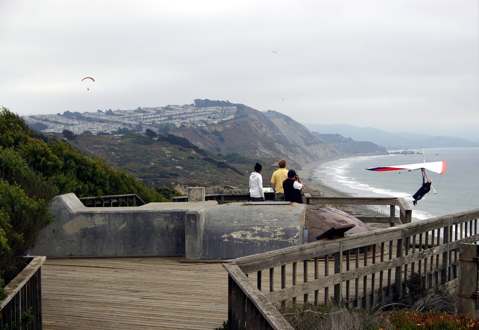 Hang glider launching from the bluffs at Fort Funston in San Francisco